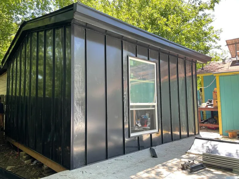 Black standing seam metal wall panels for Roof Inspection in Duncanville