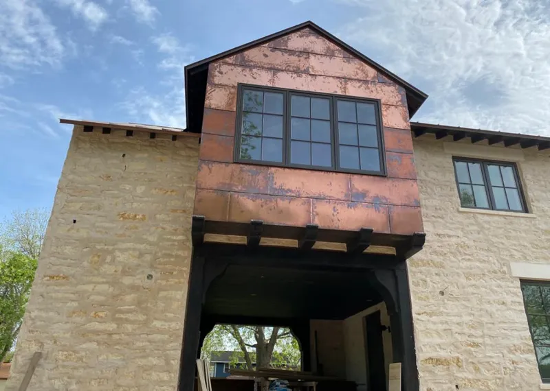 Copper metal panel facade on a stone building for Metal Roof Coating in Duncanville